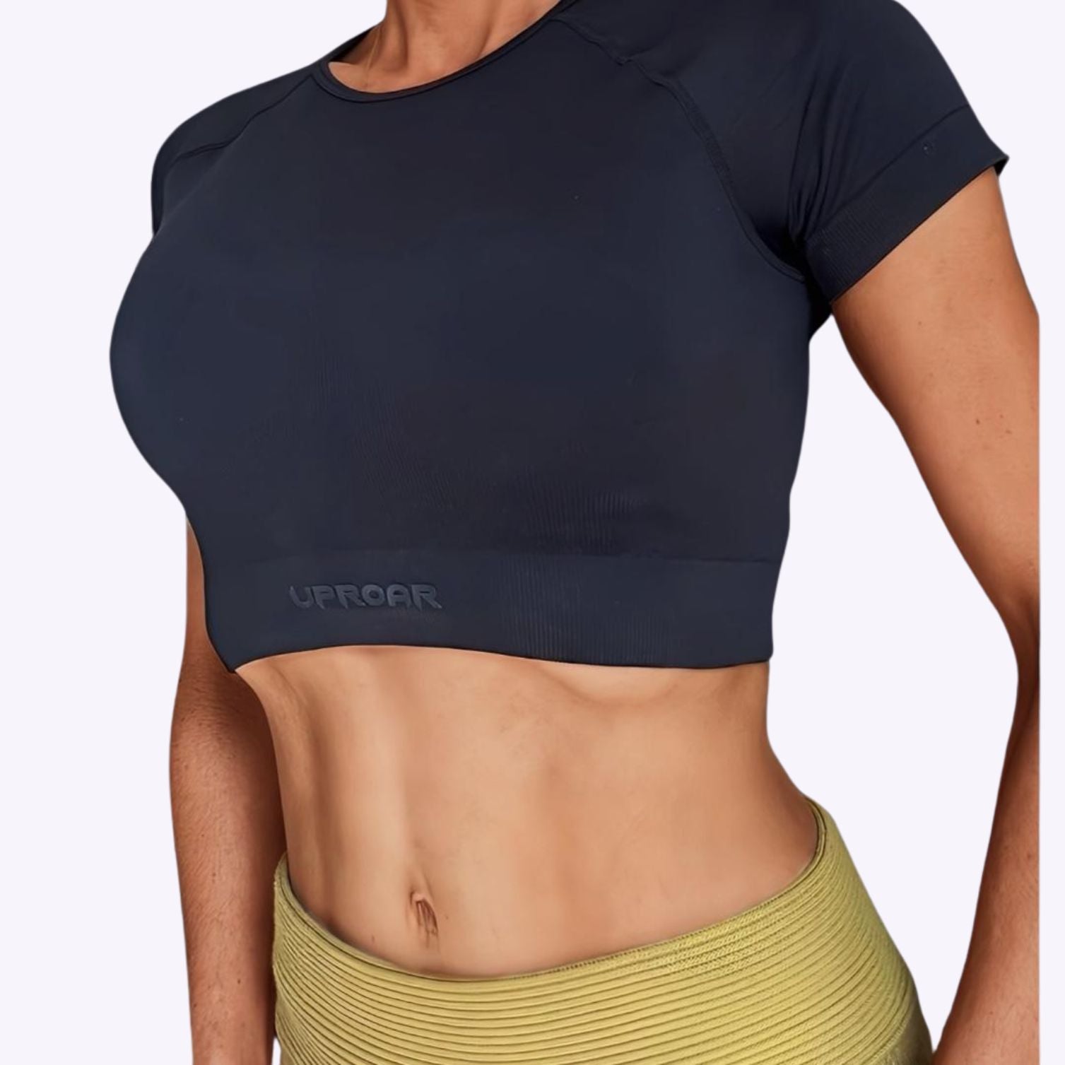 Ribbed crop top for women with short sleeves. Semi compression, colour black with uproar logo