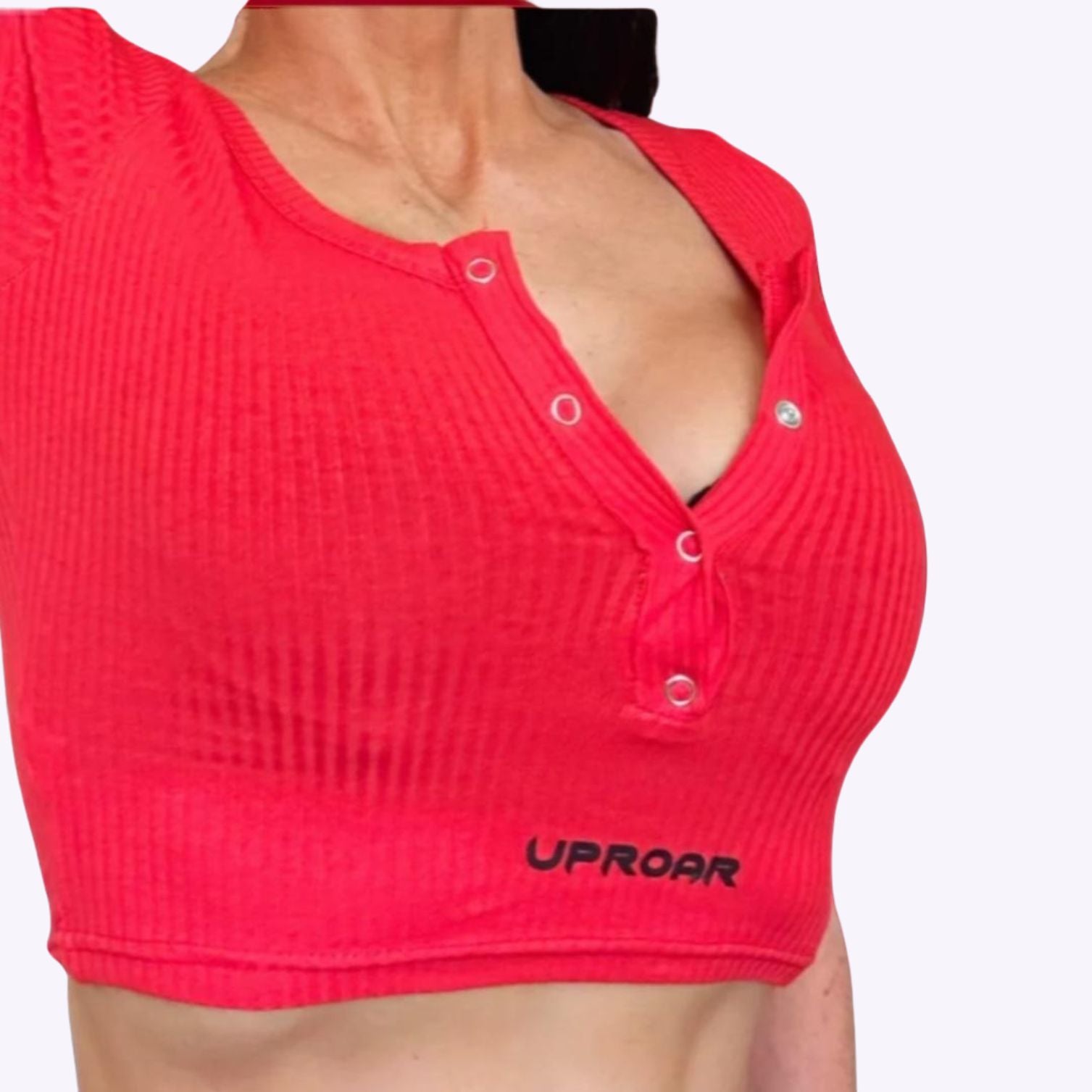 basic red crop top with light ribbing, button holes down the neck opening, short sleeve and light weight 