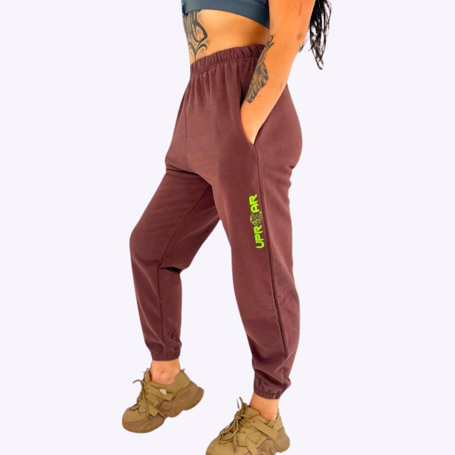 cuffed ankles, washed brown cotton material, bright green leg logo, side pockets, elastic waist, super comfortable