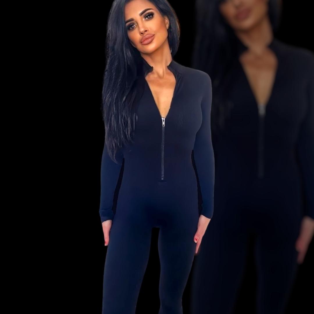 Womens one-piece bodysuit with full length arms and legs in a durable material that shapes and slims the body to perfection in all black with UPROAR logo down the leg in contrasting white