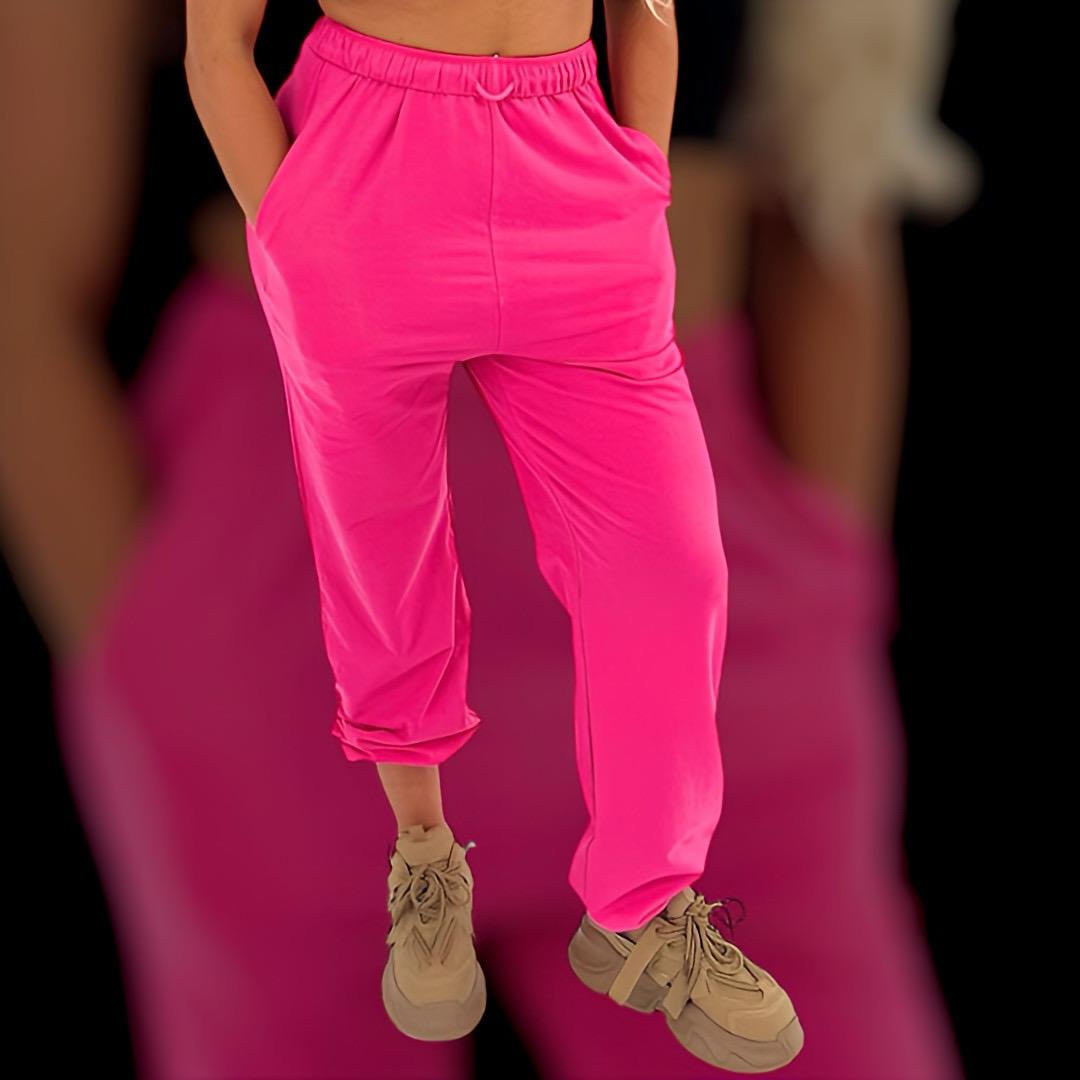 pink track pants for women with drop crotch, drawstring waist, elastic cuffed ankles and oversized look